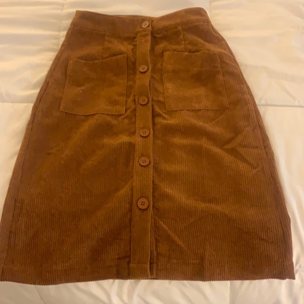 Woman’s brown corduroy midi skirt. New never worn.